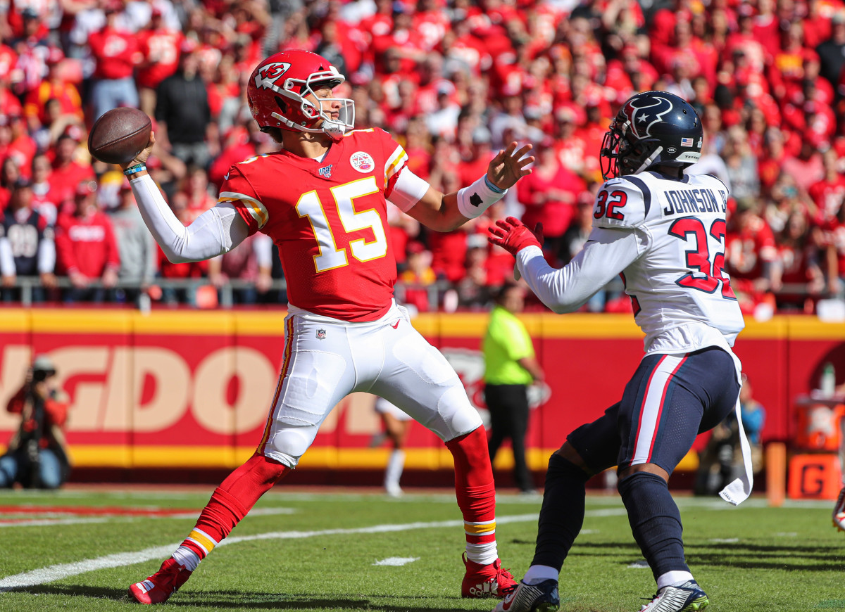 Oct 13, 2019; Kansas City, MO, USA; Kansas City Chiefs quarterback Patrick Mahomes (15) throws a pass as Houston Texans cornerback Lonnie Johnson (32) defends during the first half at Arrowhead Stadium. Mandatory Credit: Jay Biggerstaff-USA TODAY Sports